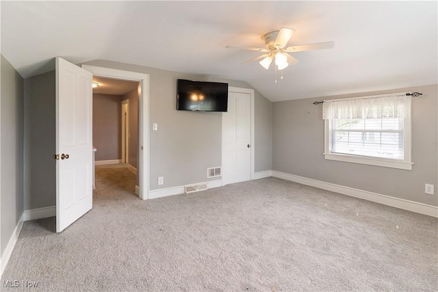 315 W Main St, Canfield, OH 44406 - unfurnished room with vaulted ceiling, ceiling fan, light carpet, and baseboards