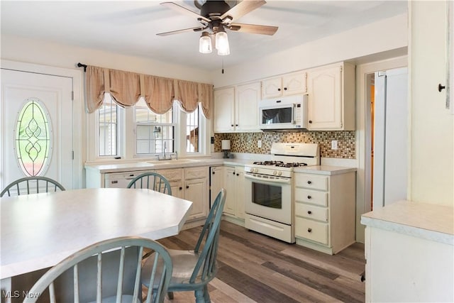 315 W Main St, Canfield, OH 44406 - kitchen featuring white appliances, a sink, tasteful backsplash, a ceiling fan, and wood finished floors