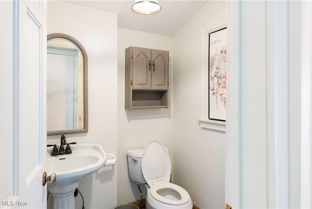 315 W Main St, Canfield, OH 44406 - bathroom with toilet and a sink