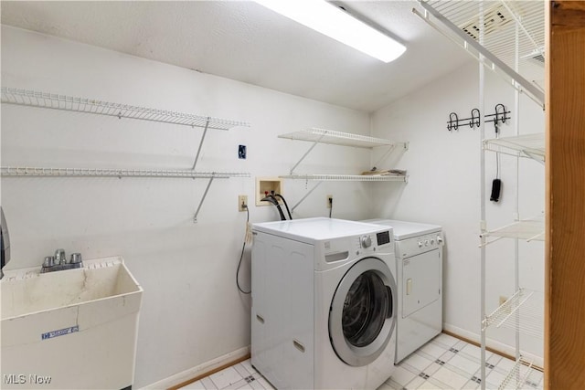 315 W Main St, Canfield, OH 44406 - clothes washing area featuring independent washer and dryer, baseboards, and light floors