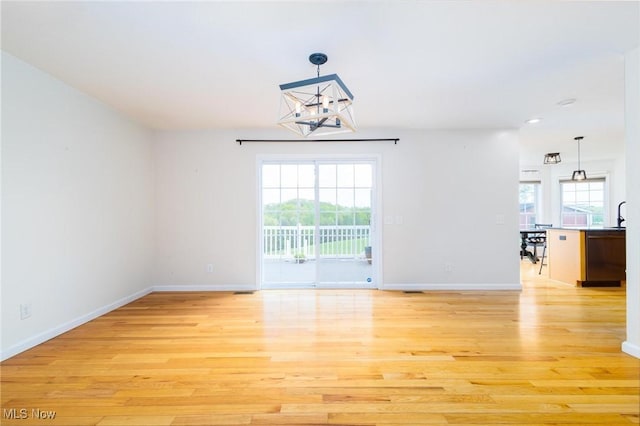 99 Township Road 262, Bloomingdale, OH 43910 - unfurnished dining area featuring light wood-style floors, a chandelier, baseboards, and recessed lighting