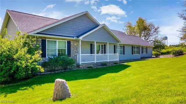 99 Township Road 262, Bloomingdale, OH 43910 - back of property with covered porch, a yard, stone siding, and roof with shingles