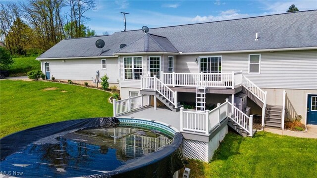 99 Township Road 262, Bloomingdale, OH 43910 - back of house with stairs, a deck, and a yard