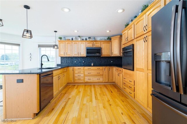 99 Township Road 262, Bloomingdale, OH 43910 - kitchen with stainless steel fridge, dishwashing machine, a sink, black oven, and a peninsula