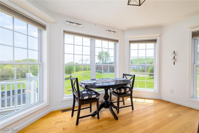 99 Township Road 262, Bloomingdale, OH 43910 - sunroom with baseboards, healthy amount of natural light, and hardwood / wood-style floors