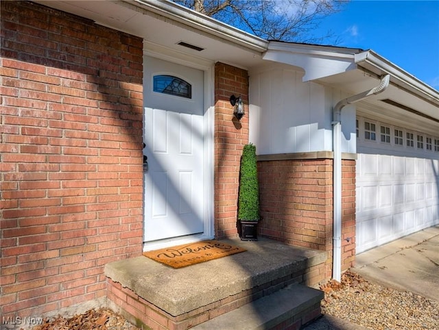 868 Eastview Ave, Wadsworth, OH 44281 - doorway to property featuring brick siding and a garage