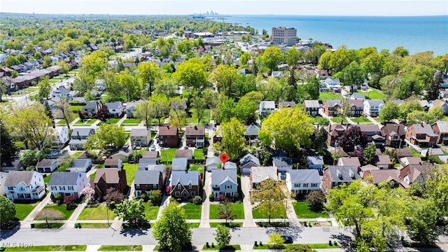 aerial view of residential area featuring a nearby body of water