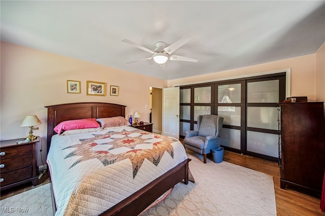 bedroom featuring wood finished floors and ceiling fan