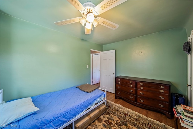 bedroom with wood finished floors and a ceiling fan