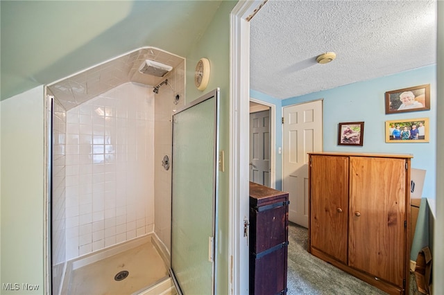 bathroom with a shower stall