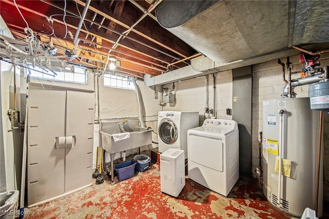 laundry room featuring water heater and washing machine and dryer