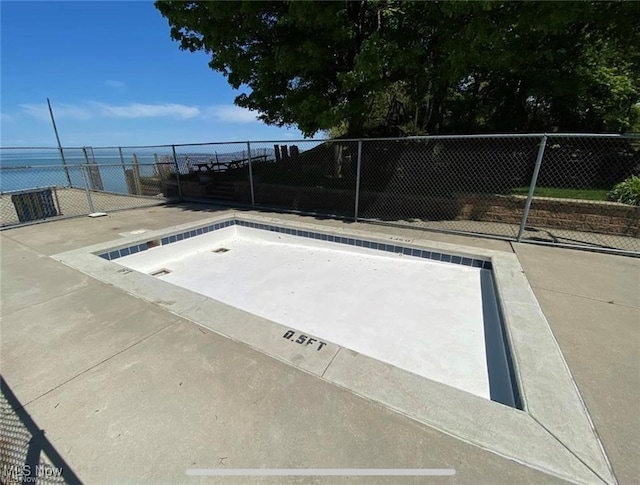 view of storm shelter with fence