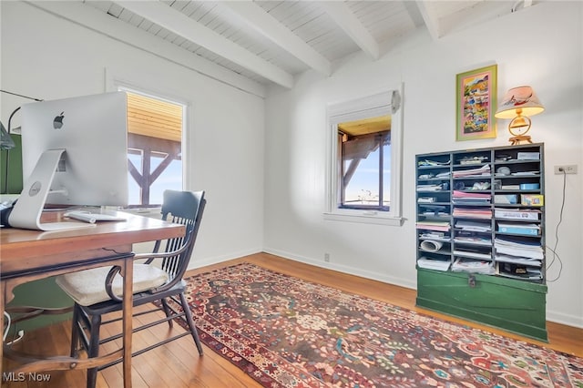 office space with beamed ceiling, wood finished floors, wooden ceiling, and baseboards