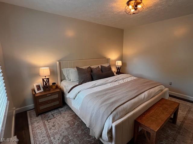 206 Anderson Ave, Bethesda, OH 43719 - bedroom with baseboards and a textured ceiling