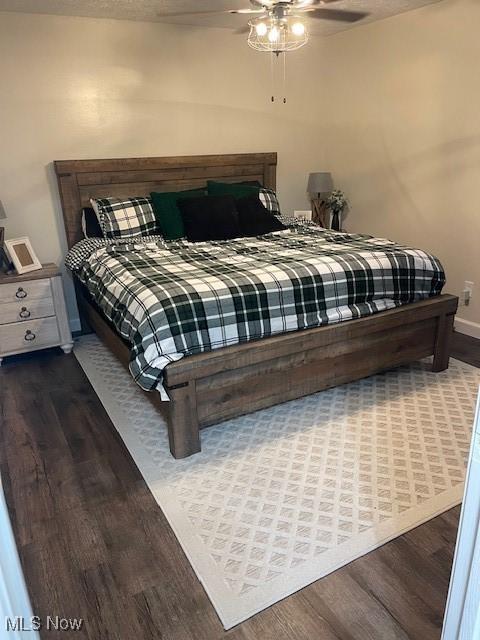 206 Anderson Ave, Bethesda, OH 43719 - bedroom featuring wood finished floors, a ceiling fan, and baseboards