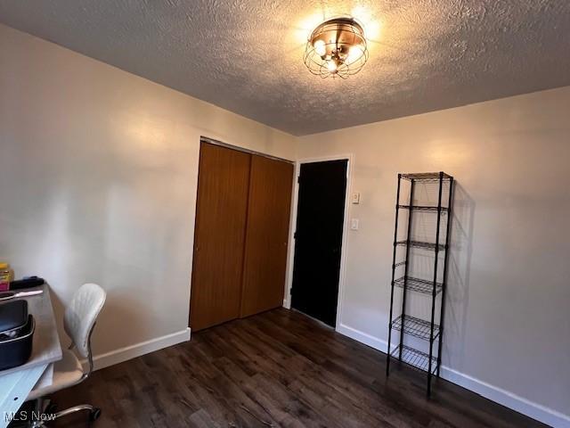 206 Anderson Ave, Bethesda, OH 43719 - office space featuring dark wood-style flooring, baseboards, and a textured ceiling