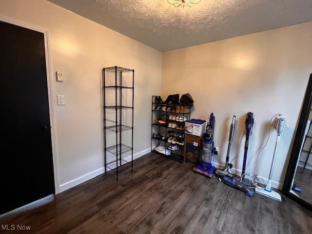 206 Anderson Ave, Bethesda, OH 43719 - misc room featuring wood finished floors, a textured ceiling, and baseboards