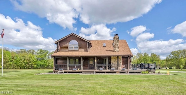 back of house featuring log siding, a lawn, a chimney, and a porch