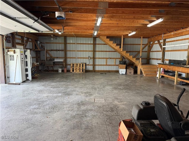 15180 Stoltz Rd, Diamond, OH 44412 - garage featuring a garage door opener and electric panel