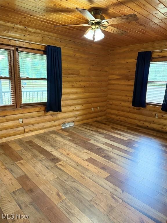 15180 Stoltz Rd, Diamond, OH 44412 - spare room featuring hardwood / wood-style floors, a ceiling fan, plenty of natural light, and wood ceiling