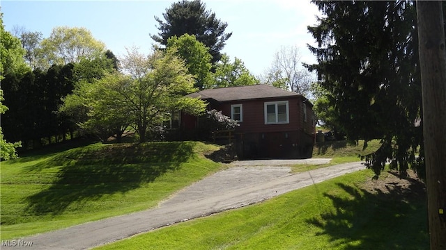 7517 Veterans Blvd, Chester, WV 26034 - view of front of house featuring driveway and a front yard