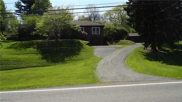 7517 Veterans Blvd, Chester, WV 26034 - view of front of home with a front lawn and driveway