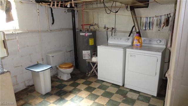 7517 Veterans Blvd, Chester, WV 26034 - clothes washing area featuring water heater, independent washer and dryer, light flooring, and concrete block wall