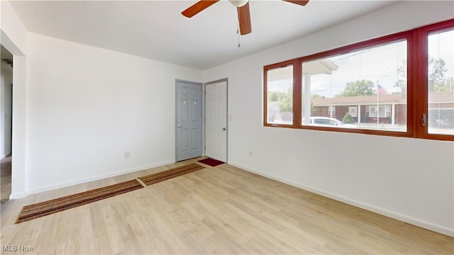 32 Ash Cir, Davisville, WV 26142 - unfurnished room with wood finished floors, ceiling fan, and baseboards