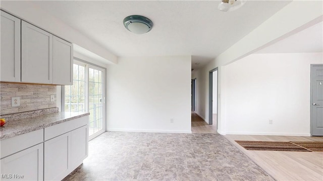 32 Ash Cir, Davisville, WV 26142 - unfurnished living room featuring baseboards