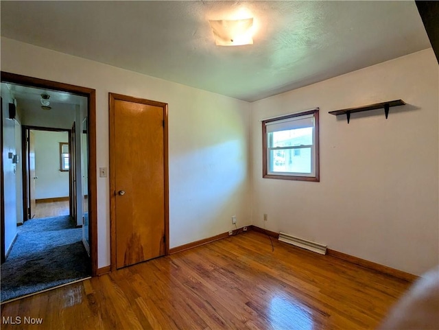 316 S Inglewood Ave, Austintown, OH 44515 - unfurnished bedroom featuring wood finished floors and baseboards