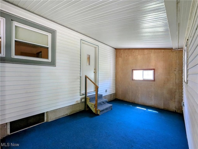 316 S Inglewood Ave, Austintown, OH 44515 - carpeted empty room featuring wooden walls and stairs