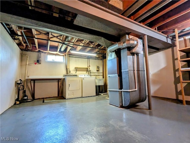 316 S Inglewood Ave, Austintown, OH 44515 - below grade area featuring independent washer and dryer, heating unit, and a sink