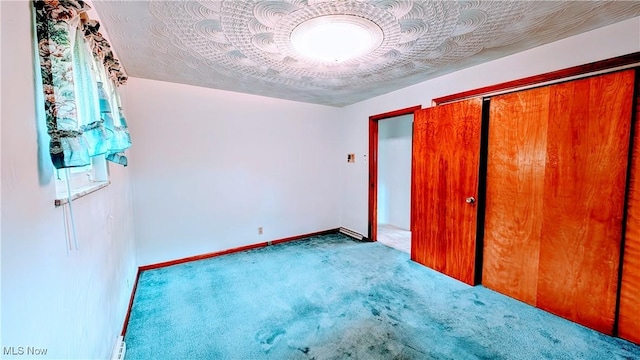 6291 Veterans Blvd, Chester, WV 26034 - unfurnished bedroom featuring carpet floors, a closet, and baseboards