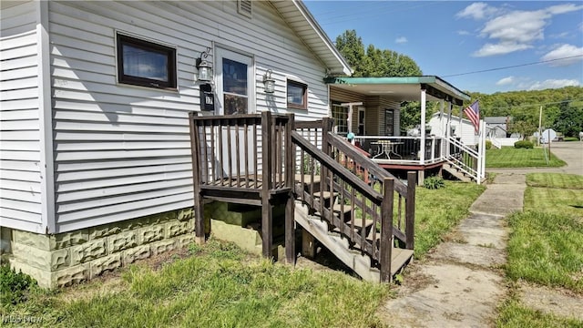 17 Spring St, Dennison, OH 44621 - property entrance featuring a wooden deck