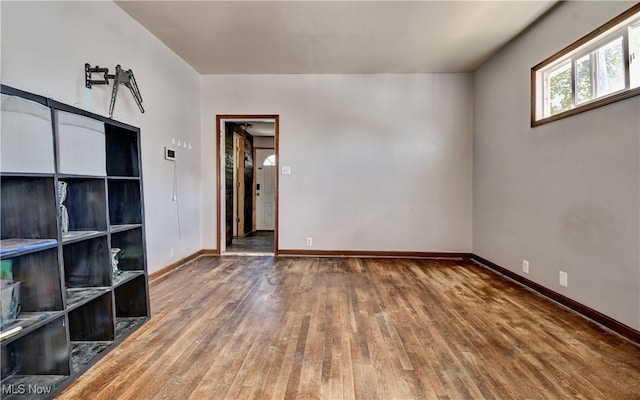 17 Spring St, Dennison, OH 44621 - empty room featuring wood-type flooring and baseboards