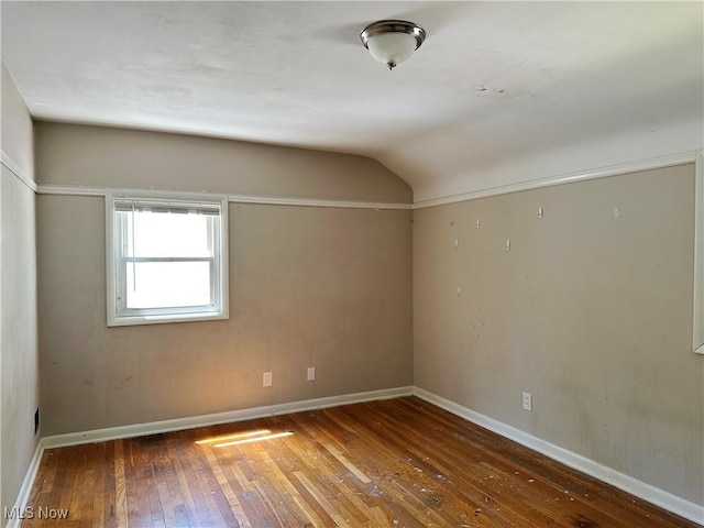 4110 Ridgeview Rd, Cleveland, OH 44144 - unfurnished room with hardwood / wood-style flooring, vaulted ceiling, and baseboards