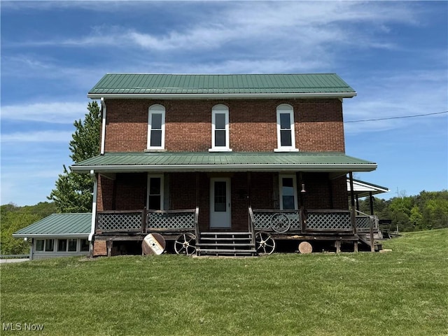 6255 Highland Ridge Rd, Lowell, OH 45744 - view of front of house with brick siding, metal roof, a front yard, and covered porch