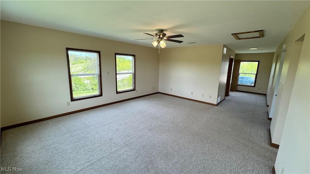 6255 Highland Ridge Rd, Lowell, OH 45744 - spare room featuring attic access, baseboards, light carpet, and ceiling fan