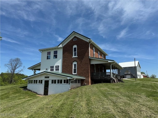 6255 Highland Ridge Rd, Lowell, OH 45744 - rear view of property with brick siding and a lawn