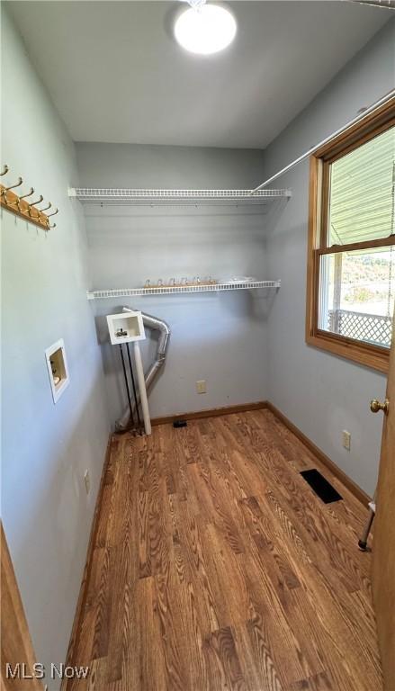 6255 Highland Ridge Rd, Lowell, OH 45744 - clothes washing area with washer hookup, wood finished floors, and baseboards