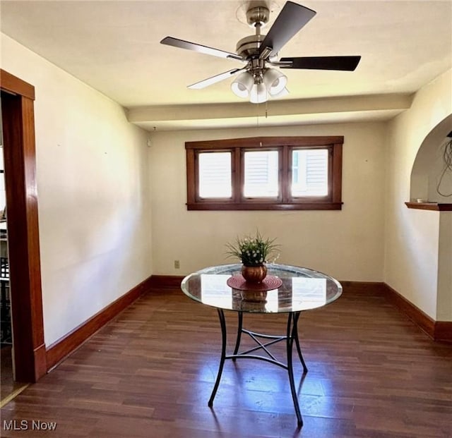 dining space featuring baseboards, wood finished floors, and ceiling fan
