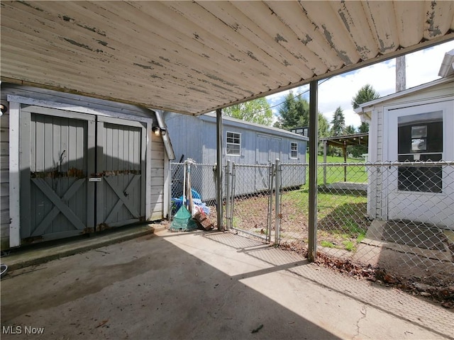111 Pine Ln, Barnesville, OH 43713 - view of patio / terrace with fence, a gate, a shed, and an outdoor structure