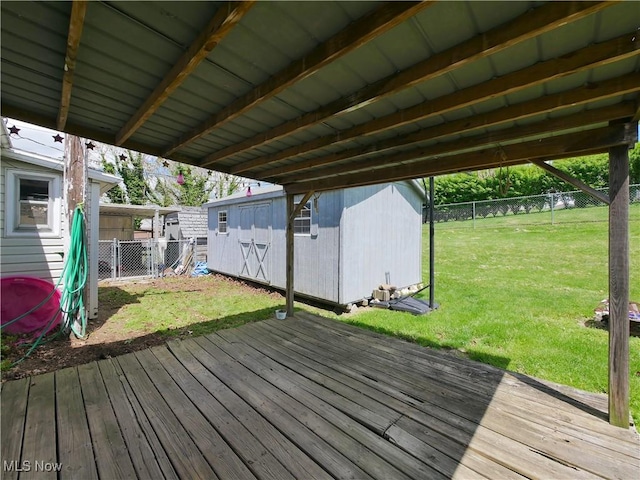 111 Pine Ln, Barnesville, OH 43713 - wooden terrace with a storage unit and an outbuilding