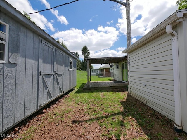 111 Pine Ln, Barnesville, OH 43713 - view of grassy yard with an outbuilding and a storage shed
