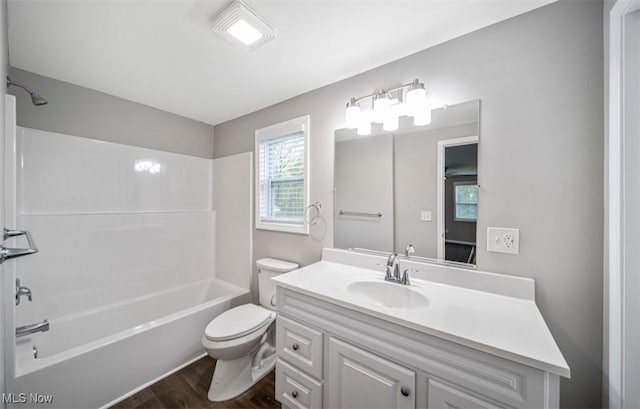 1527 Carterland Dr, Ashtabula, OH 44004 - bathroom with toilet, wood finished floors, washtub / shower combination, and vanity