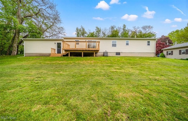 1527 Carterland Dr, Ashtabula, OH 44004 - back of property featuring a deck, a lawn, and cooling unit