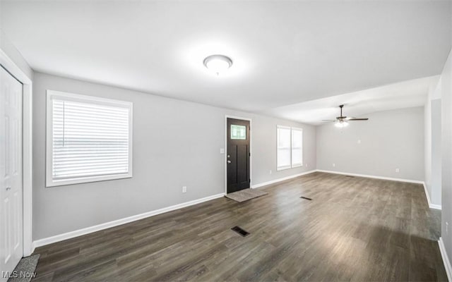 1527 Carterland Dr, Ashtabula, OH 44004 - unfurnished living room with baseboards, dark wood finished floors, and a ceiling fan