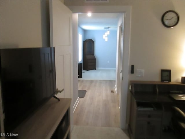 hall featuring wood finished floors