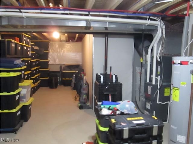 unfinished below grade area featuring water heater