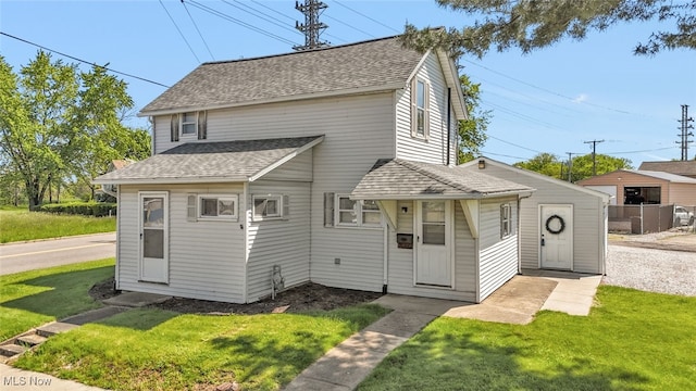 2000 Henry Ave SW, Canton, OH 44706 - view of front of property with a shingled roof and a front lawn